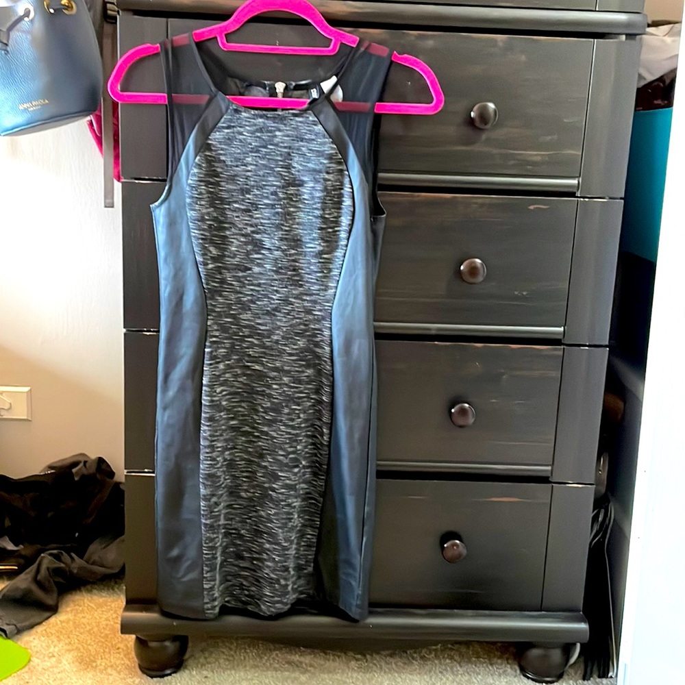 Women’s dress. Soft and subtle design in the middle, faux leather sides.